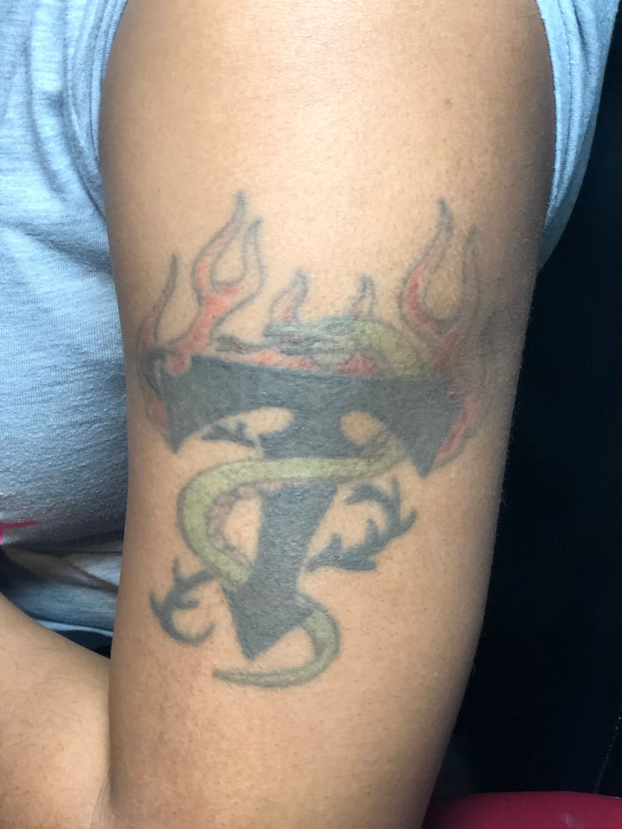 Cover-up before: Faded cross + flames · 10+ years old